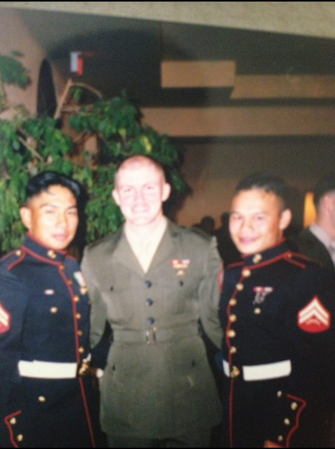 Israel Martinez in service uniform with fellow Marines in dress blues